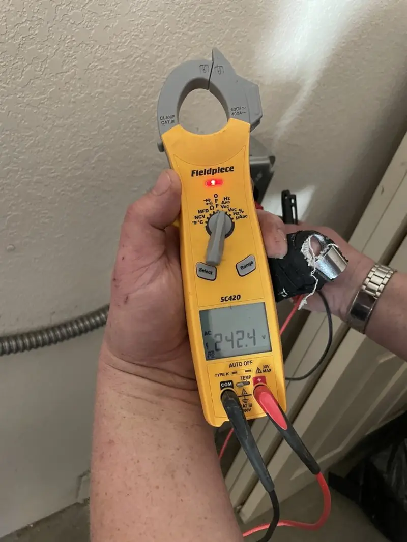 Voltage testing with clamp meter during Electrical Installation Services in Flatwoods